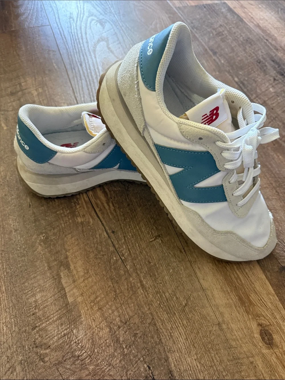 New Balance White Sneakers with Blue 'N' Logo